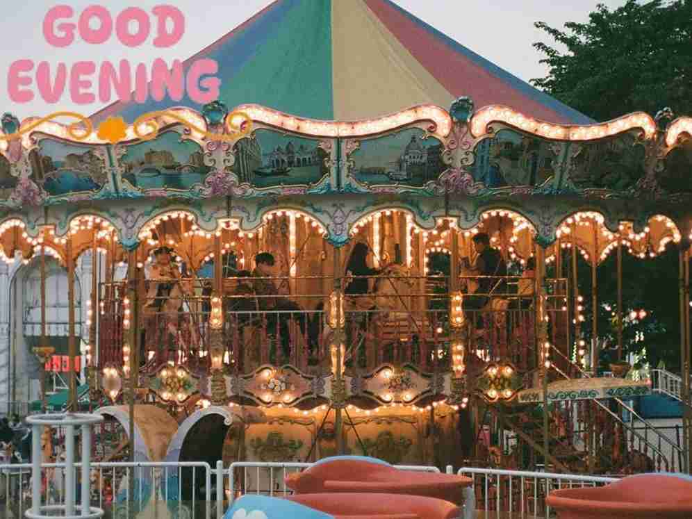 Carousel at night with colorful lights, perfect for sharing good evening pictures with friends.