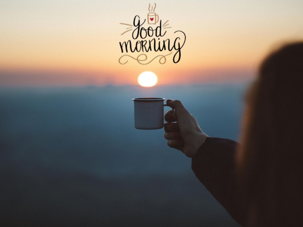 A woman enjoys a cup of coffee as the sun rises, embodying a serene saturday morning moment.