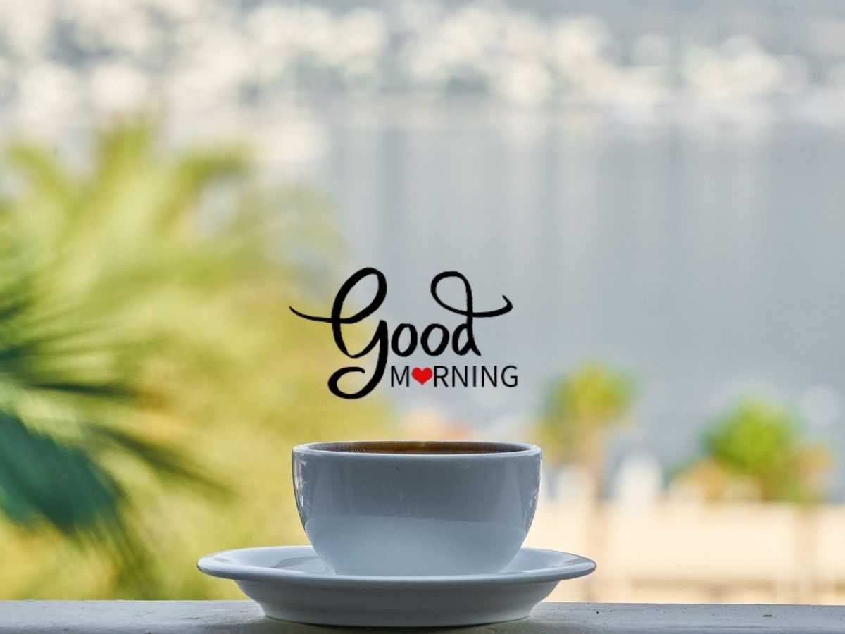 A steaming coffee cup on a table, symbolizing a warm sunday morning greeting.